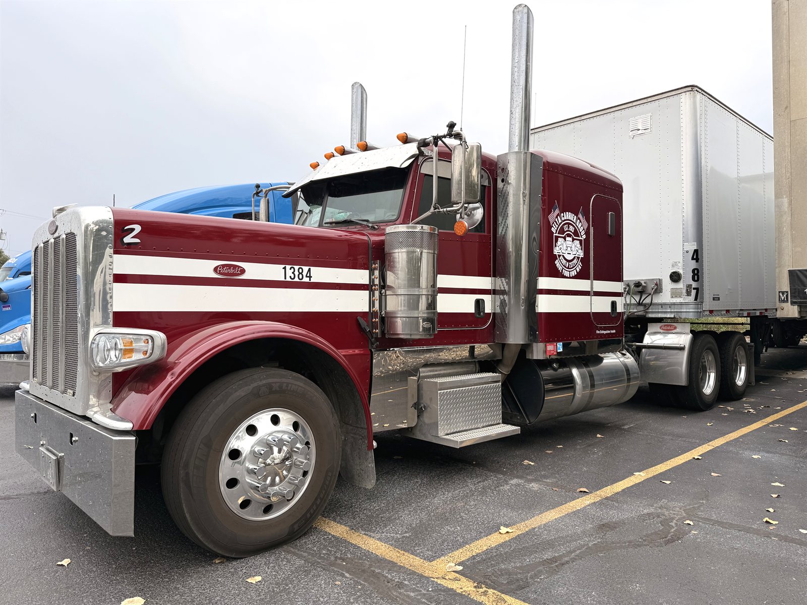 Classic long-hood Peterbilt coupled to a dry van trailer at the Delta yard, unit 1384