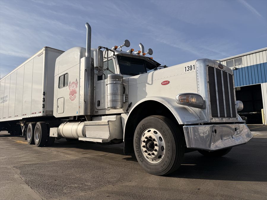 Delta Carrier Group white Peterbilt 389 unit 1391 yard